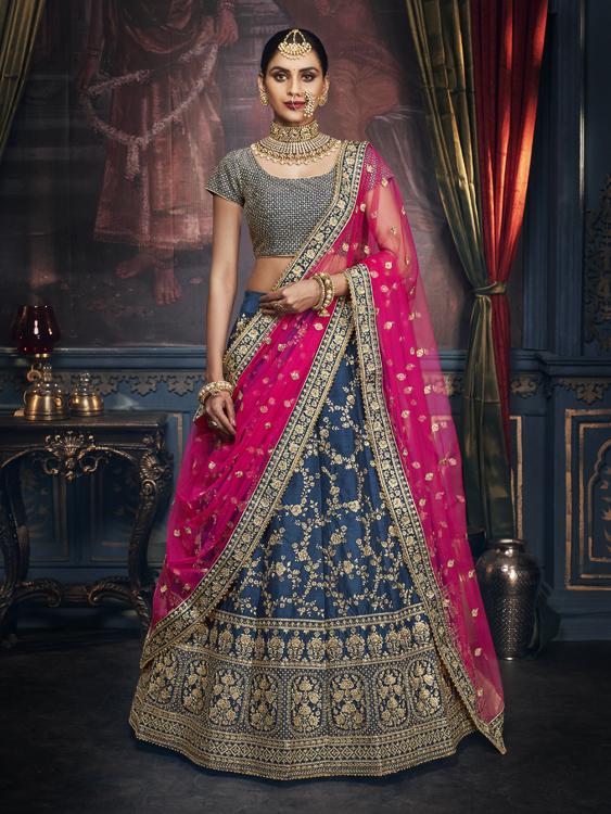 Peacock Blue Raw Silk Lehenga With Cancan Paired With Pink Premium Mono Net Dupatta and Peacock Blue Raw Silk Blouse  - Rabina Baksh